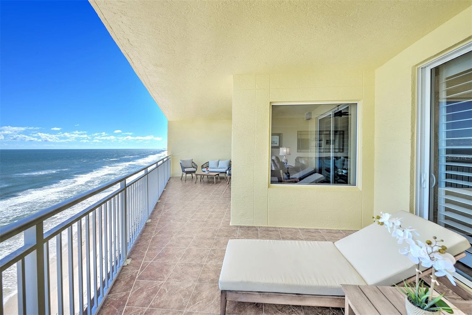 Primary suite sliders open to balcony. - 1900 N ATLANTIC AVE #1603, DAYTONA BEACH