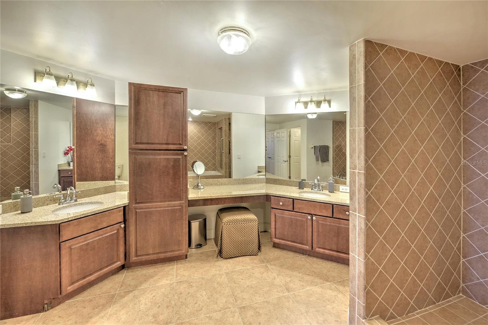 Primary Bath double vanities and granite counter top. - 1900 N ATLANTIC AVE #1603, DAYTONA BEACH