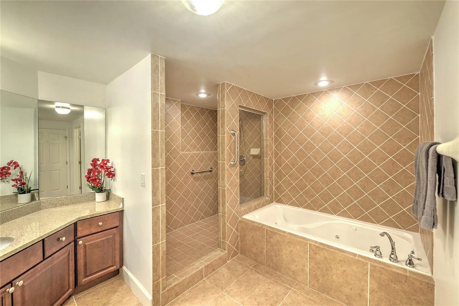 Tub and separate shower in Primary Bath. - 1900 N ATLANTIC AVE #1603, DAYTONA BEACH