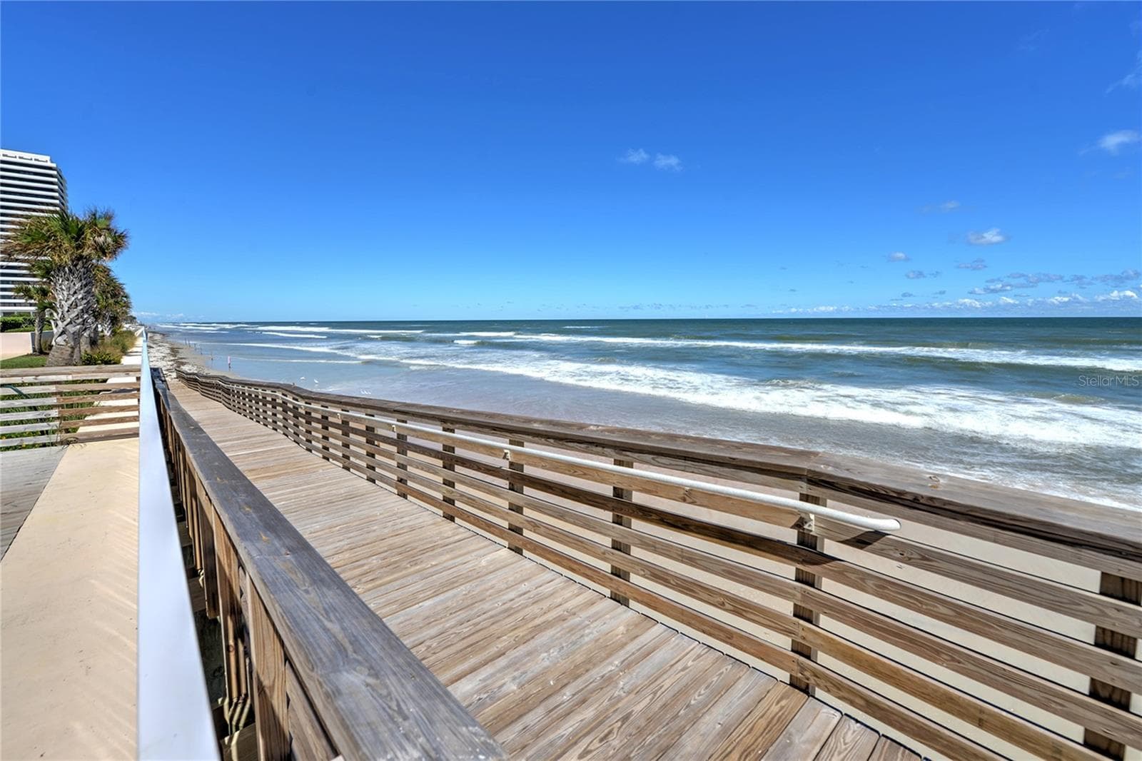 Walkway from pool to beach. - 1900 N ATLANTIC AVE #1603, DAYTONA BEACH