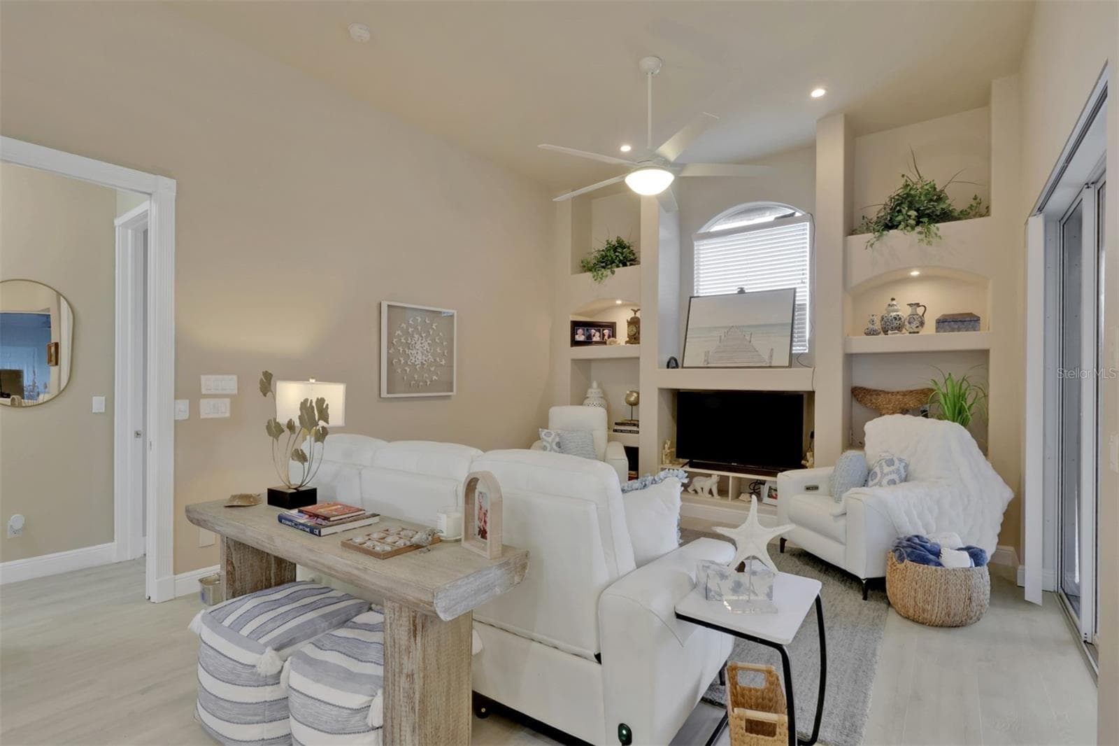 Family room with built in shelves - 8451 SOUTHWIND BAY CIR, FORT MYERS