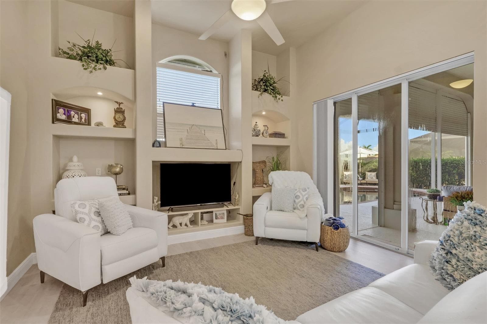 family room with sliders to lanai area - 8451 SOUTHWIND BAY CIR, FORT MYERS