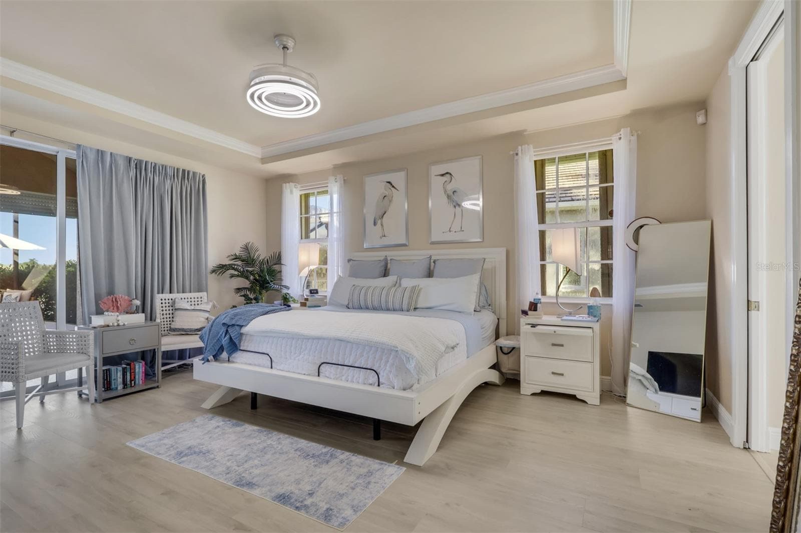 Primary Bedroom overlooking pool and lake - 8451 SOUTHWIND BAY CIR, FORT MYERS