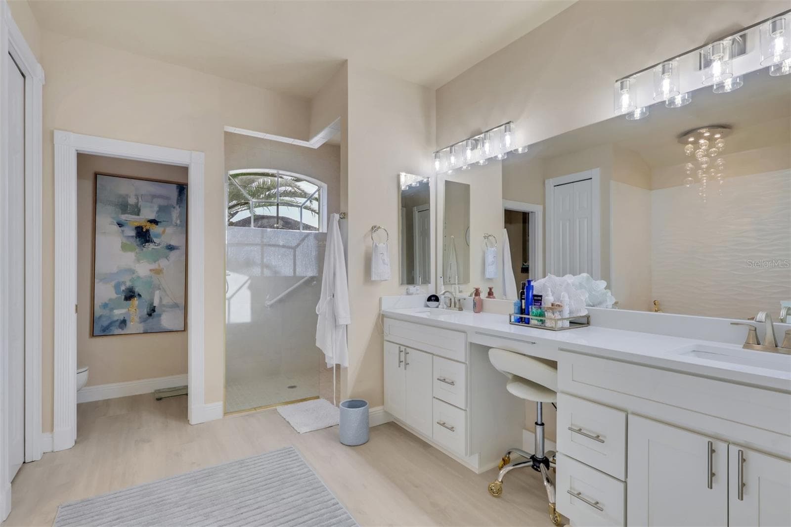 Primary Bathroom with dual vanities and makeup area - 8451 SOUTHWIND BAY CIR, FORT MYERS