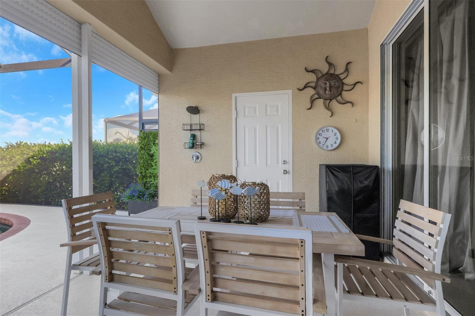 Dining area on lanai overlooking pool and lake - 8451 SOUTHWIND BAY CIR, FORT MYERS