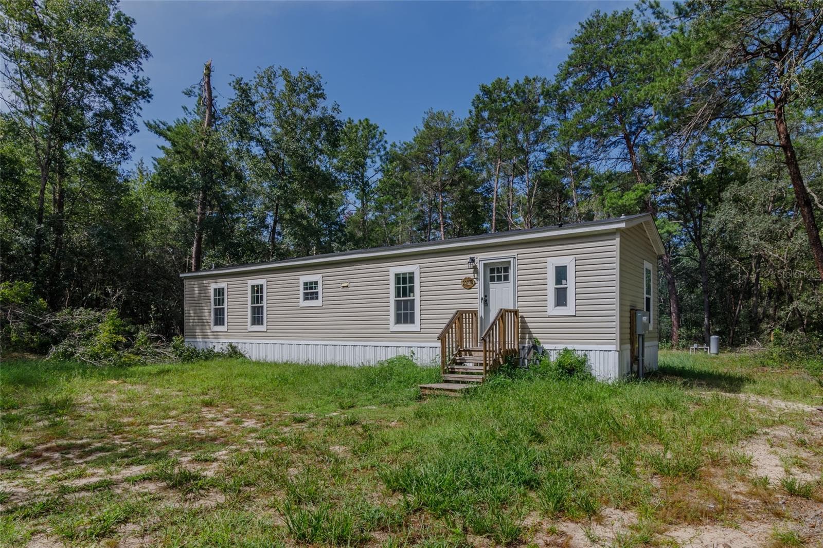 Manufactured Home at 23778 NE 113TH AVE, FORT MC COY, photo 2 of 22