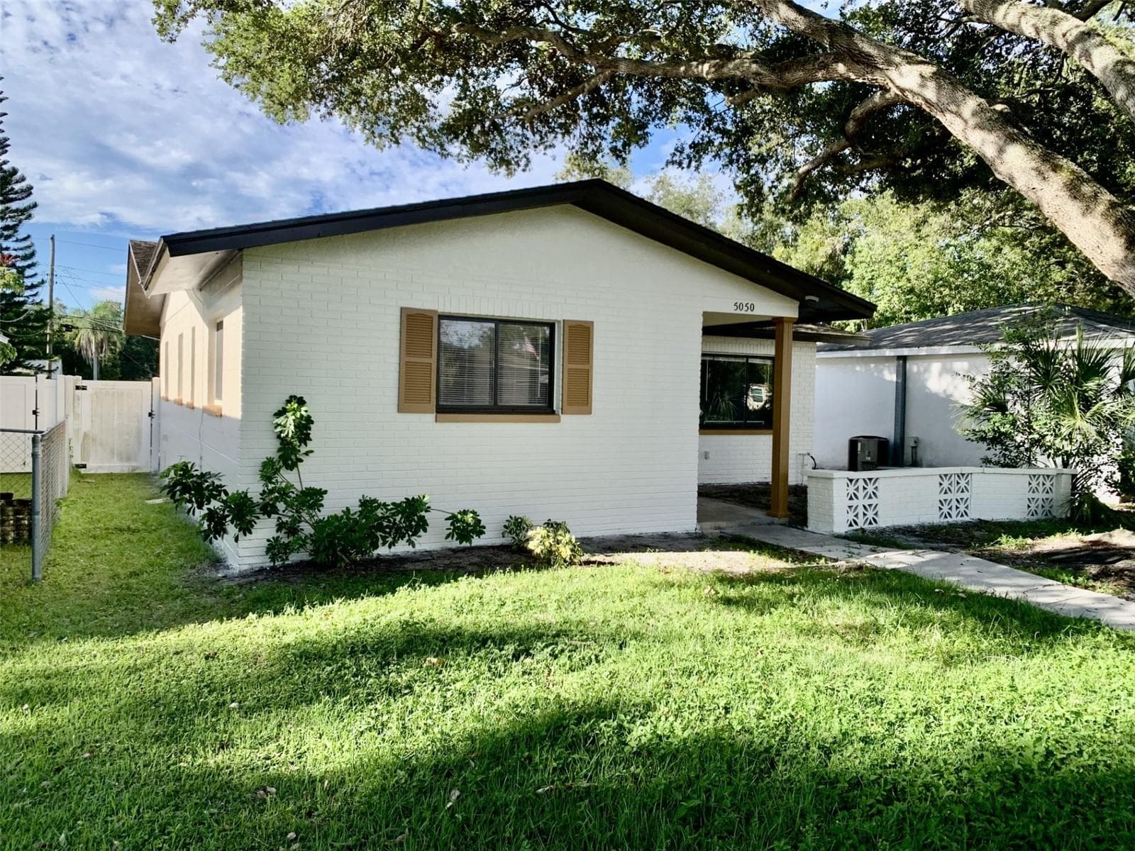 Street view showing fresh new exterior paint - 5050 29TH AVE N, ST PETERSBURG