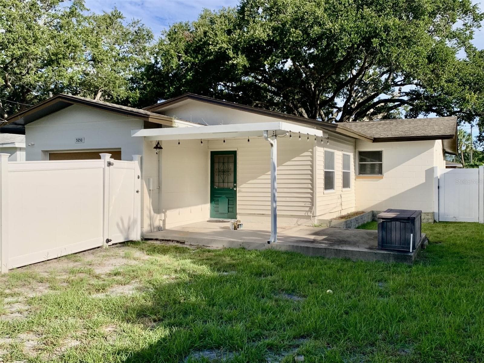 Fenced back yard has covered lanai - 5050 29TH AVE N, ST PETERSBURG