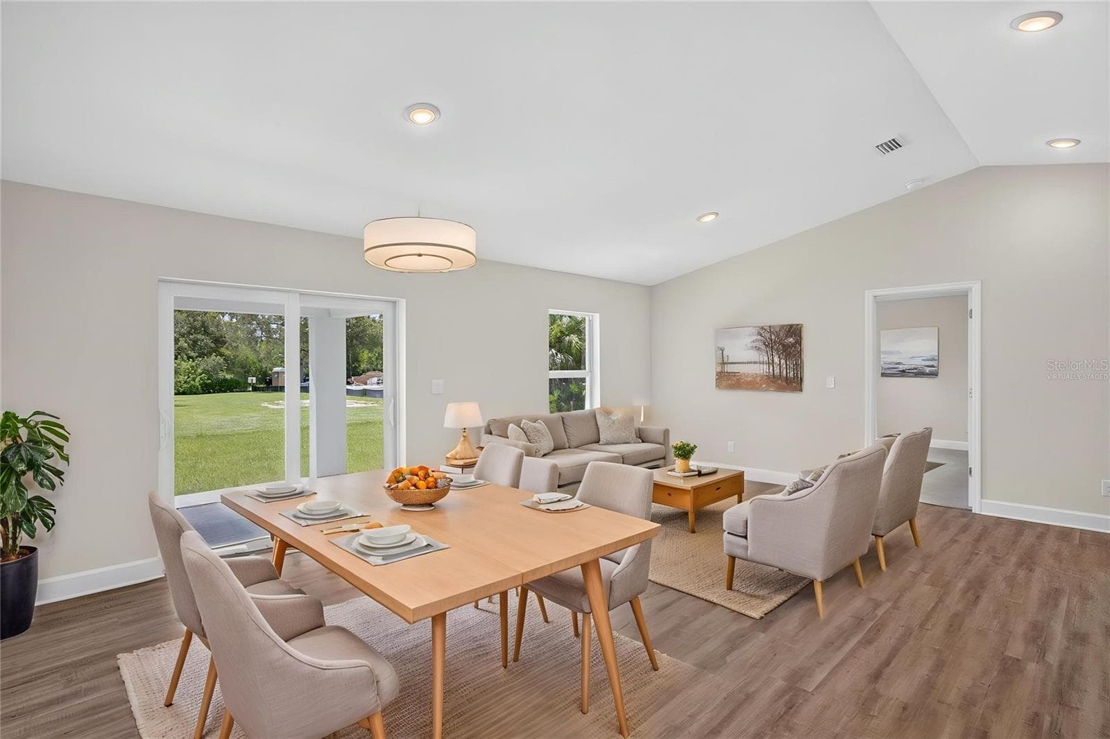 Virtually Staged Living room dining room - 434 AVELLA ST, PORT CHARLOTTE