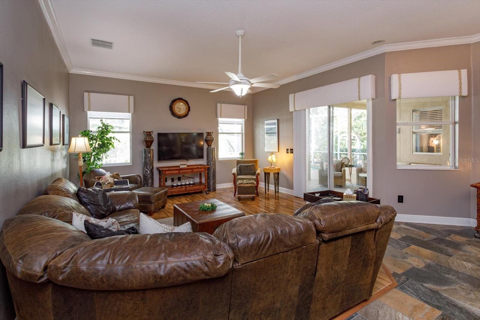 family room views to pool and lanai - 536 AVON GLADE PL, SANFORD