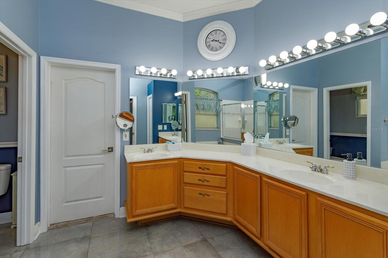 Primary bath with dual sinks and direct access to bedroom 2 - 536 AVON GLADE PL, SANFORD