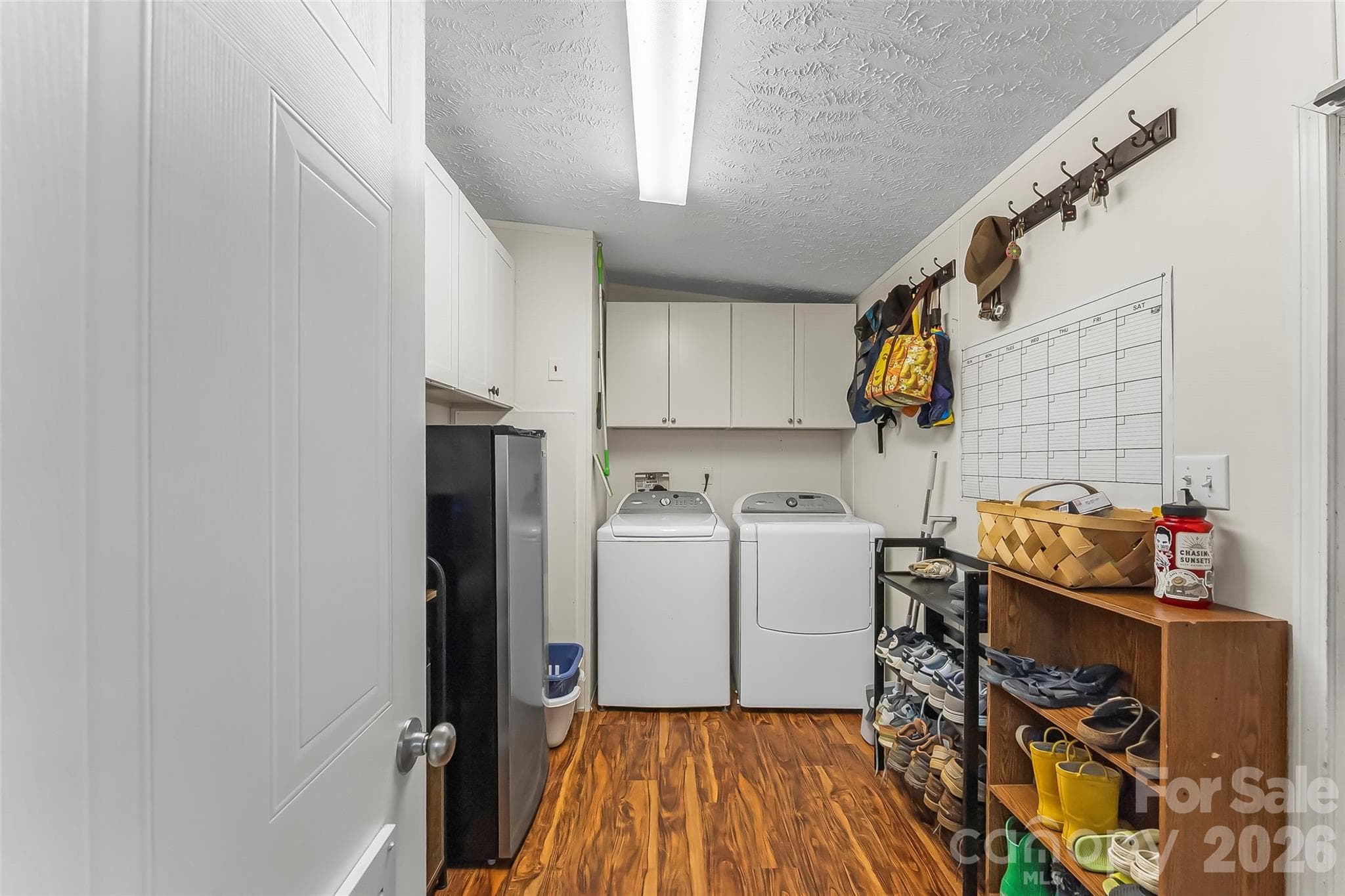 Large laundry room / mud room with cabinets - 245 Merry Way, Clyde