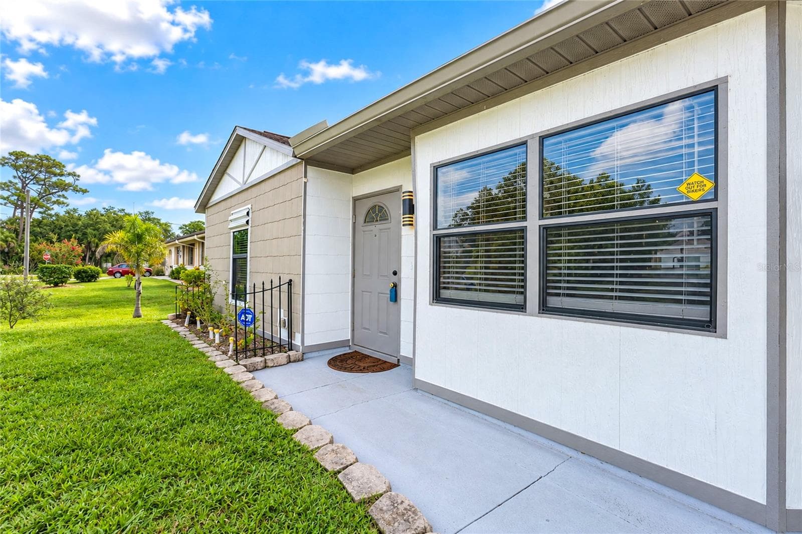 Walk from the driveway to the front door. - 21293 PEMBERTON AVENUE, PORT CHARLOTTE