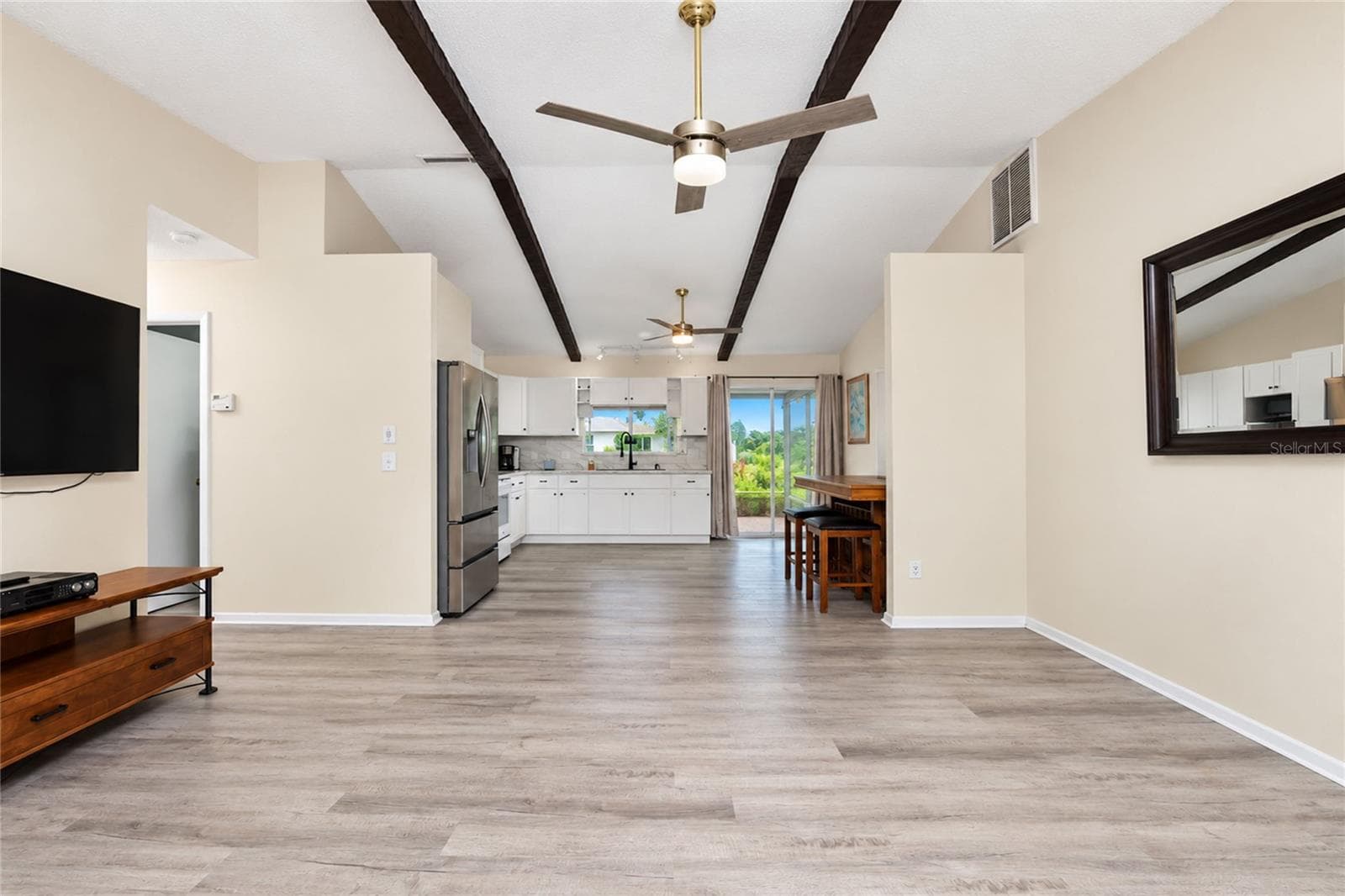 View as you enter the front door looking through the living room, dinette and kitchen to the lanai. - 21293 PEMBERTON AVENUE, PORT CHARLOTTE