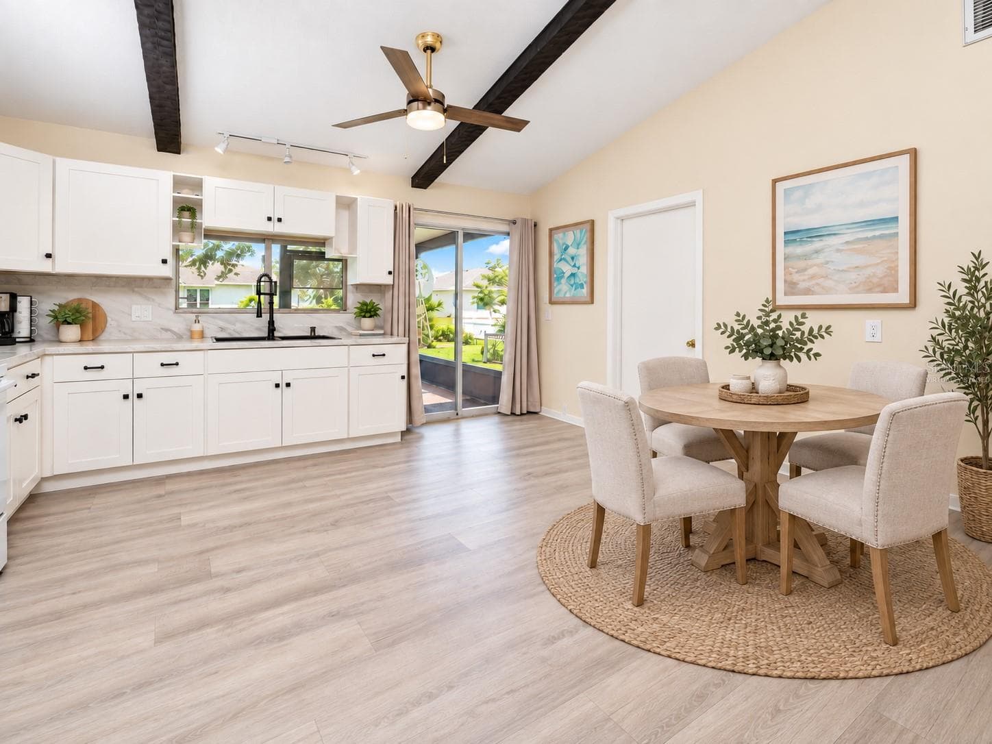 View of the dinette and kitchen.  VIRTUALLY STAGED. - 21293 PEMBERTON AVENUE, PORT CHARLOTTE