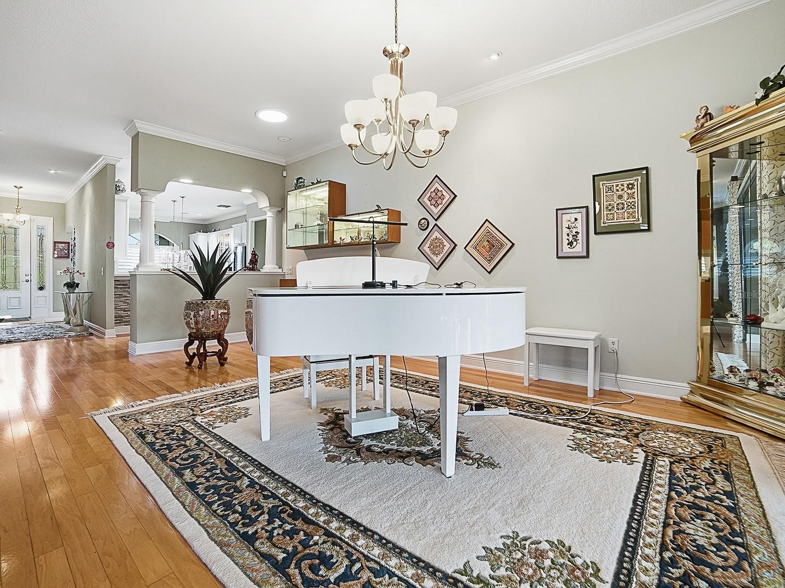 SPACIOUS DINING ROOM -- ALSO A PERFECT PLACE FOR A PIANO! BEAUTIFUL HARDWOOD FLOORING THROUGHOUT THE LIVING AND DINING AREA, HALLWAY, 1 GUEST ROOM, AND PRIMARY BEDROOM. - 1897 HARTFORD PATH, THE VILLAGES
