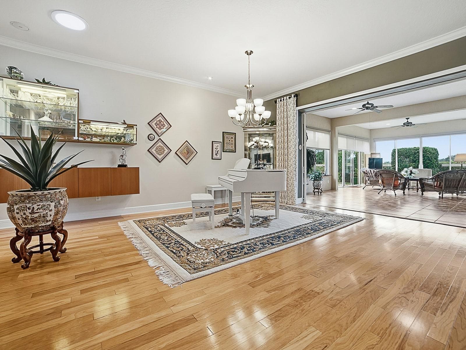 FLOATING CABINET AND SHELVING WAS ADDED IN THE DINING AREA AND A SOLAR TUBE FOR MORE NATURAL LIGHTING. - 1897 HARTFORD PATH, THE VILLAGES