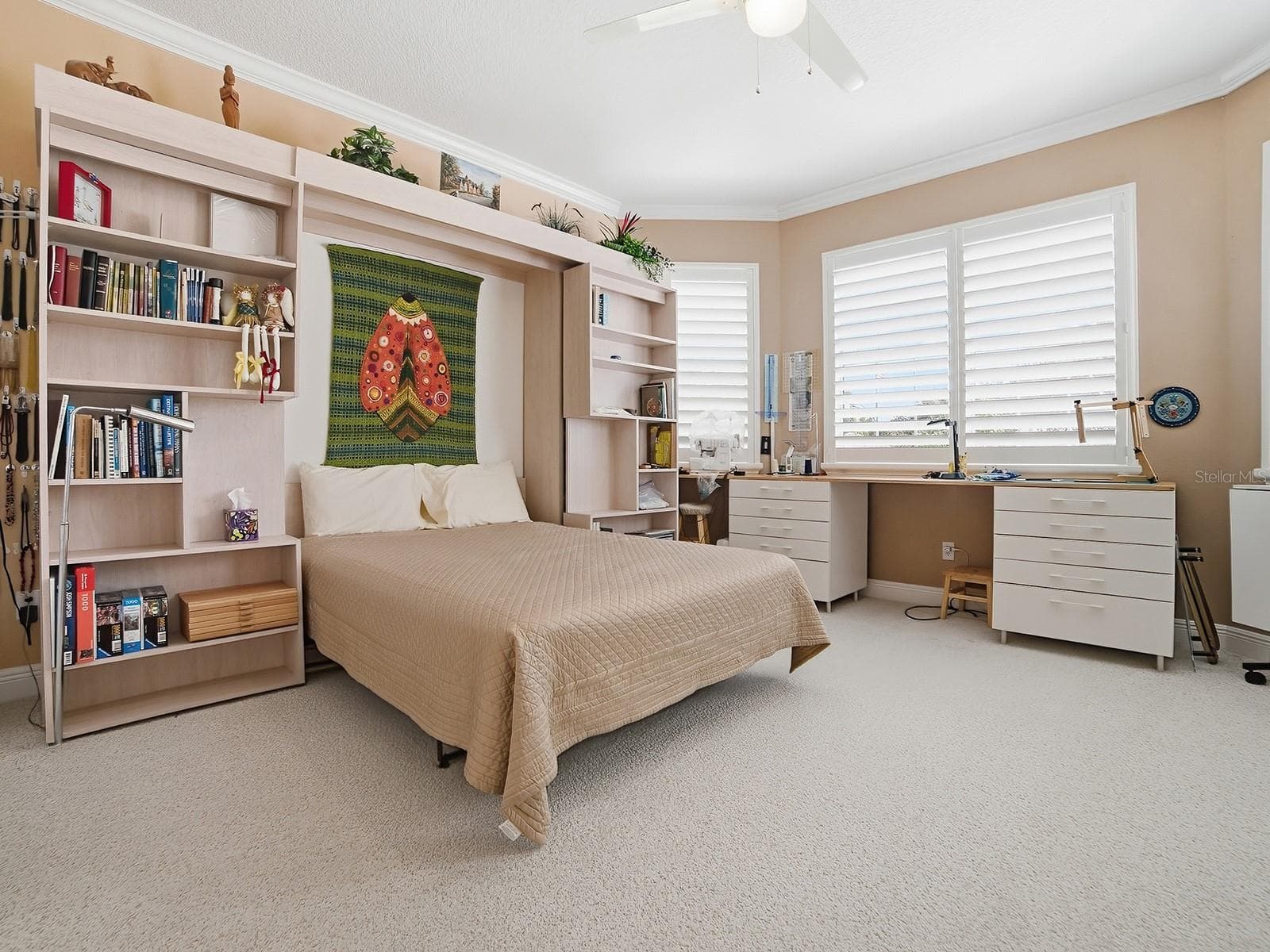 THE GUEST ROOMS HAVE BEEN EXPANDED SEVERAL FEET IN THE FRONT AND SIDE. A LARGE CLOSET WAS ADDED TO THIS ROOM AND A CONVENIENT MURPHY BED. THIS ROOM IS BEING USED AS A SEWING ROOM. - 1897 HARTFORD PATH, THE VILLAGES