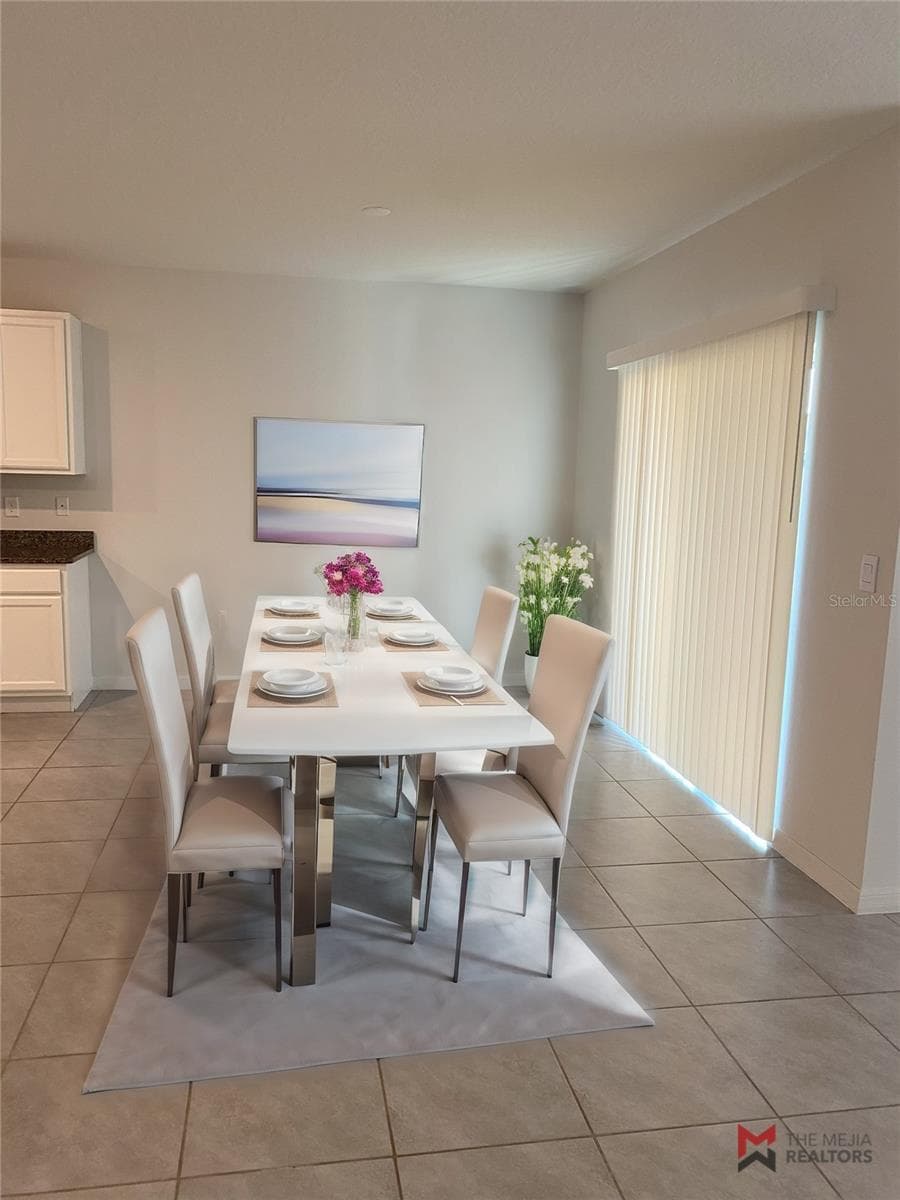 Staged dining room - 2723 SUNKISSED DR, ST CLOUD