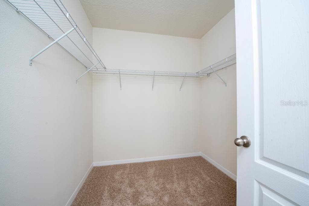 Master Bedroom Walk-in closet - 2723 SUNKISSED DR, ST CLOUD