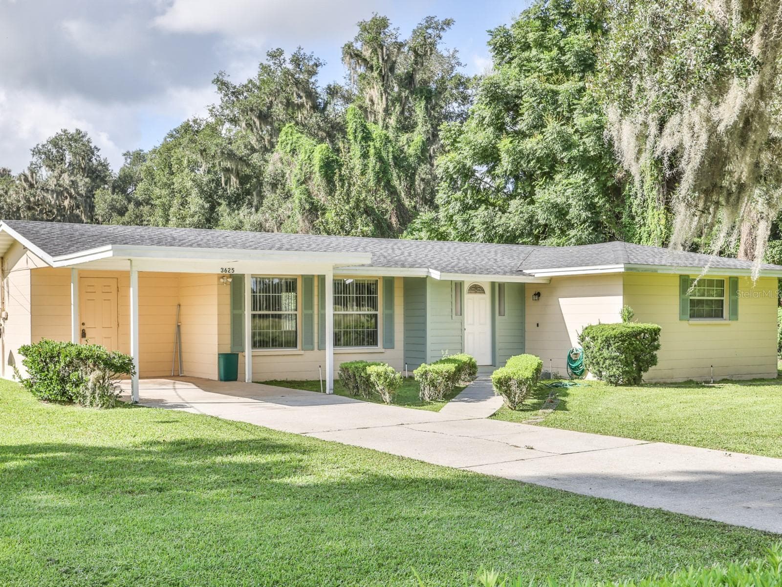 Front of the home with a one car carport. - 3625 E GANDY RD, BARTOW