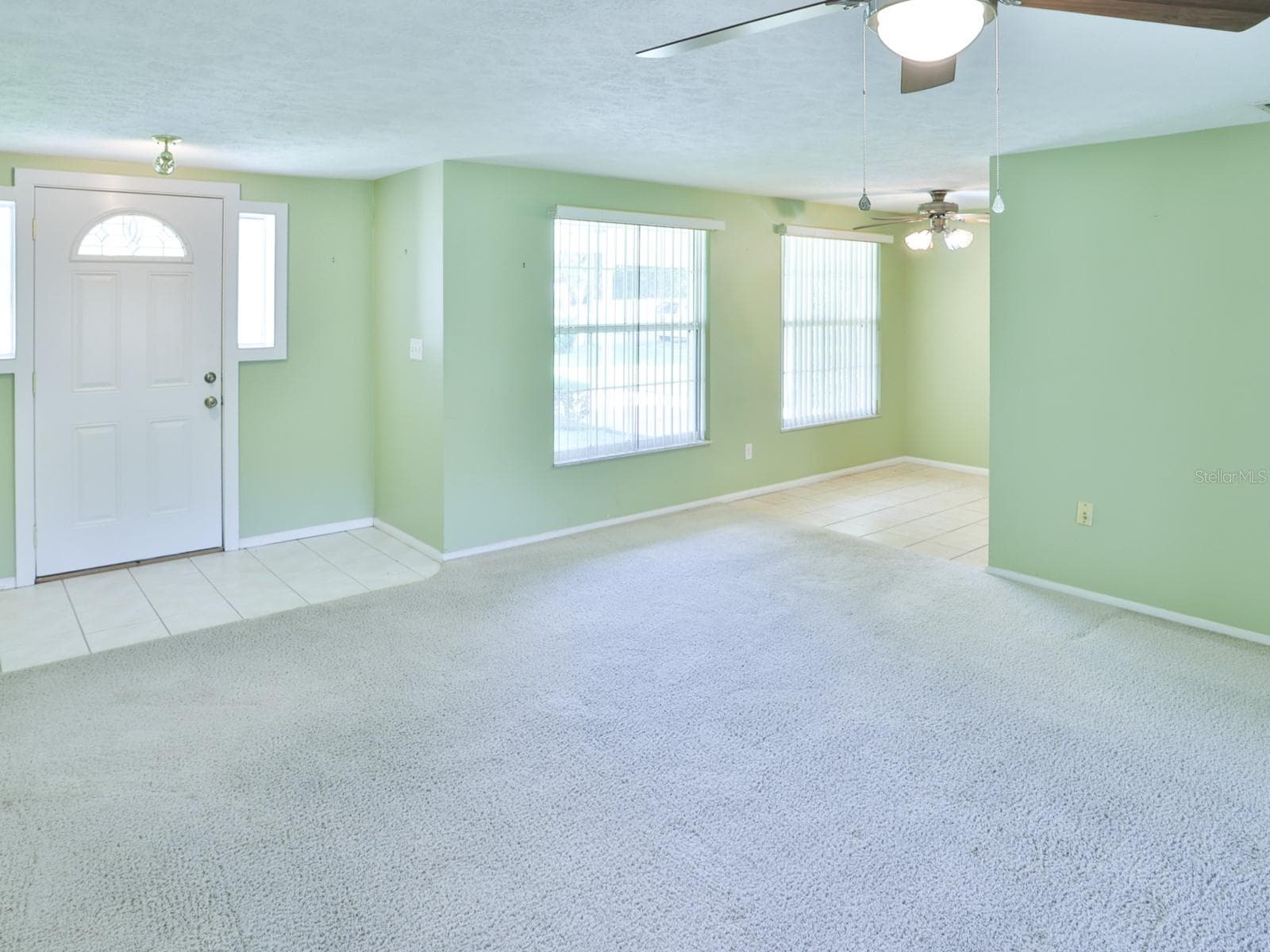 Living room with view of the dining room. - 3625 E GANDY RD, BARTOW