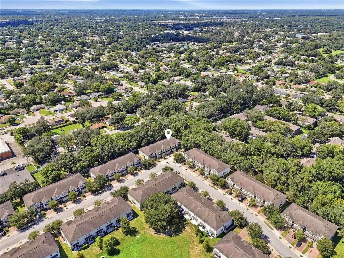 Aerial view showcasing the tree-lined community and prime lot location - 7560 ALOMA PINES CT, WINTER PARK
