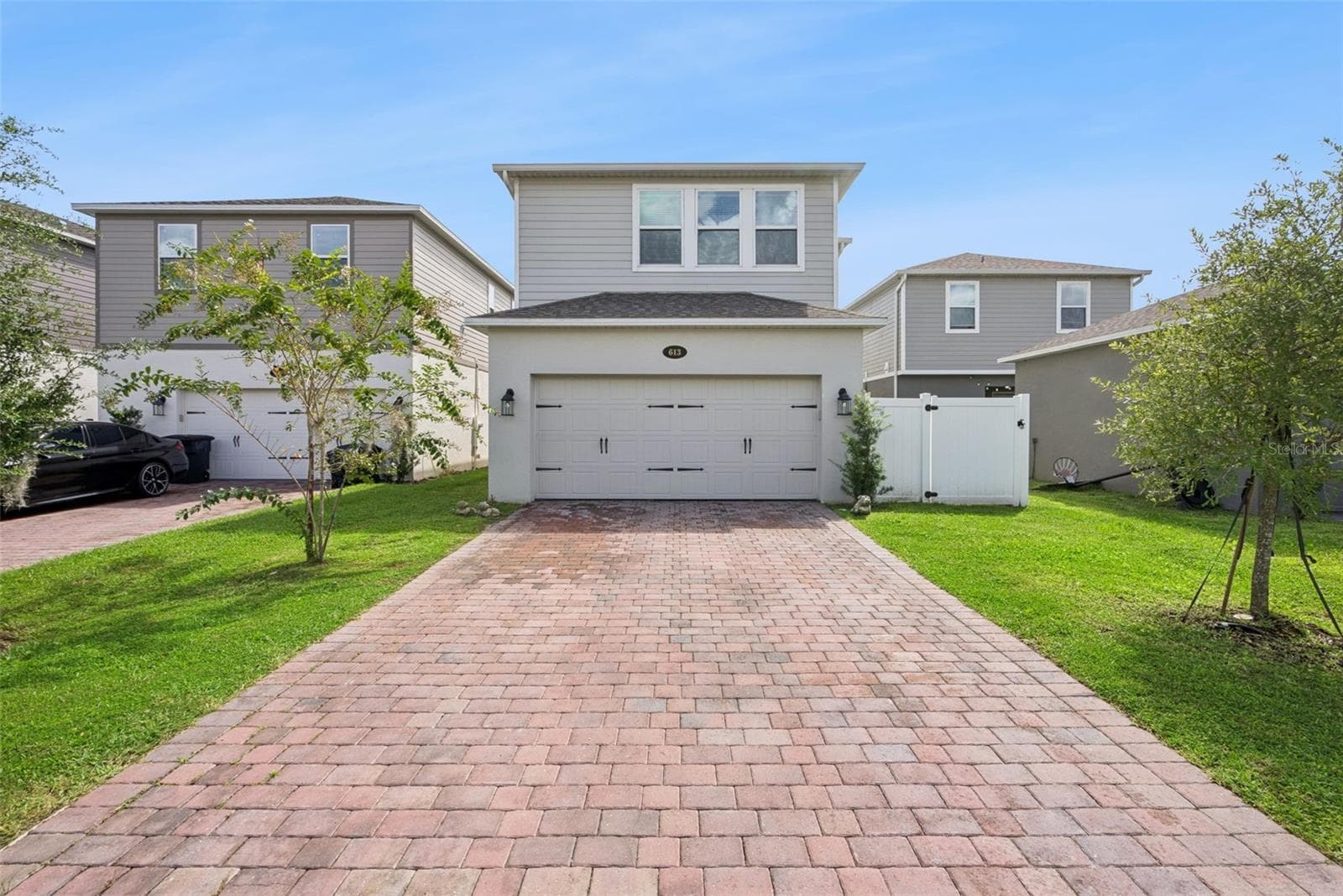 Rear Garage and Paver Driveway - 613 CHEVAL LN, DEBARY