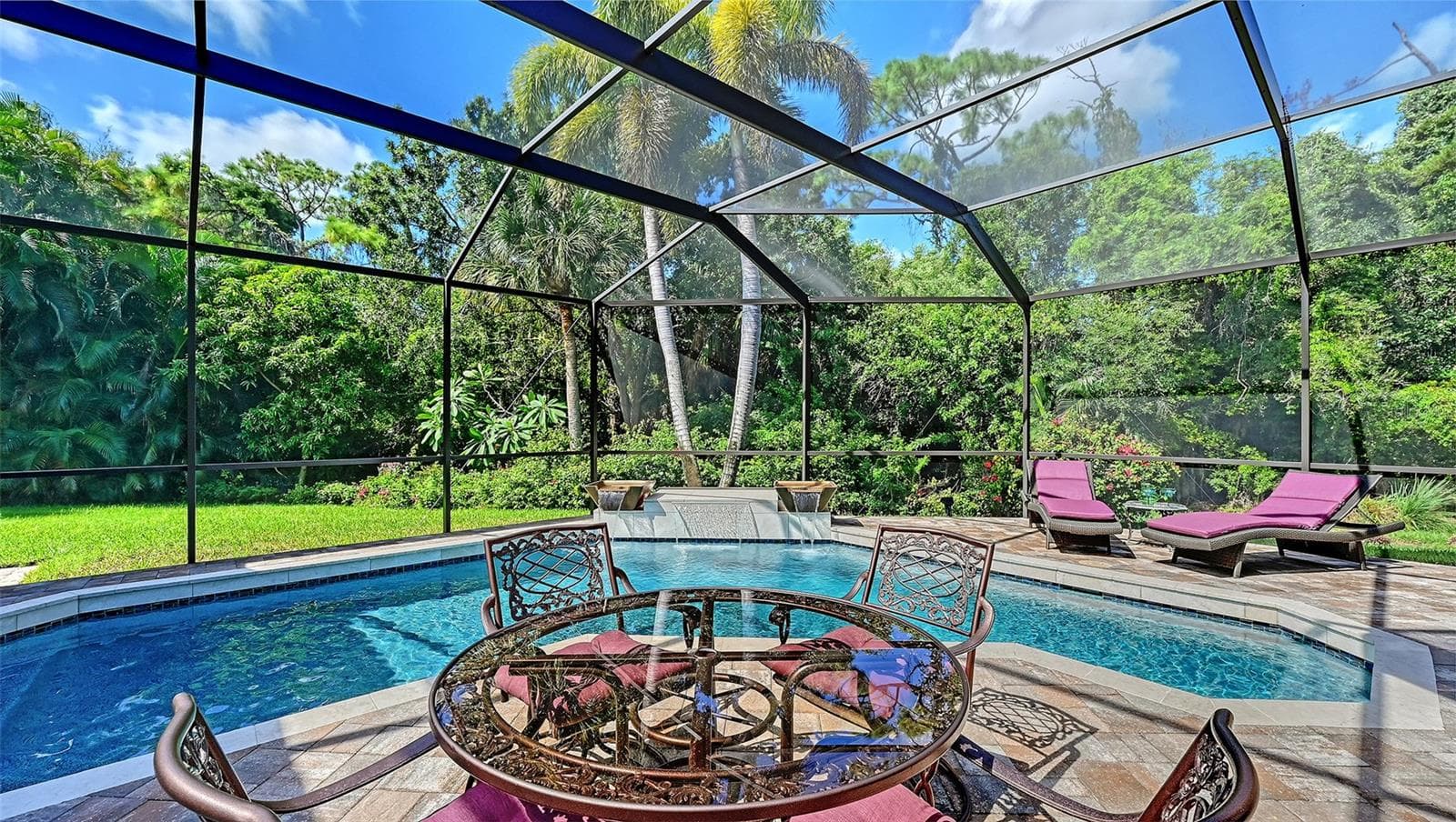 Screened pool area with waterfall. - 8866 BLOOMFIELD BLVD, SARASOTA