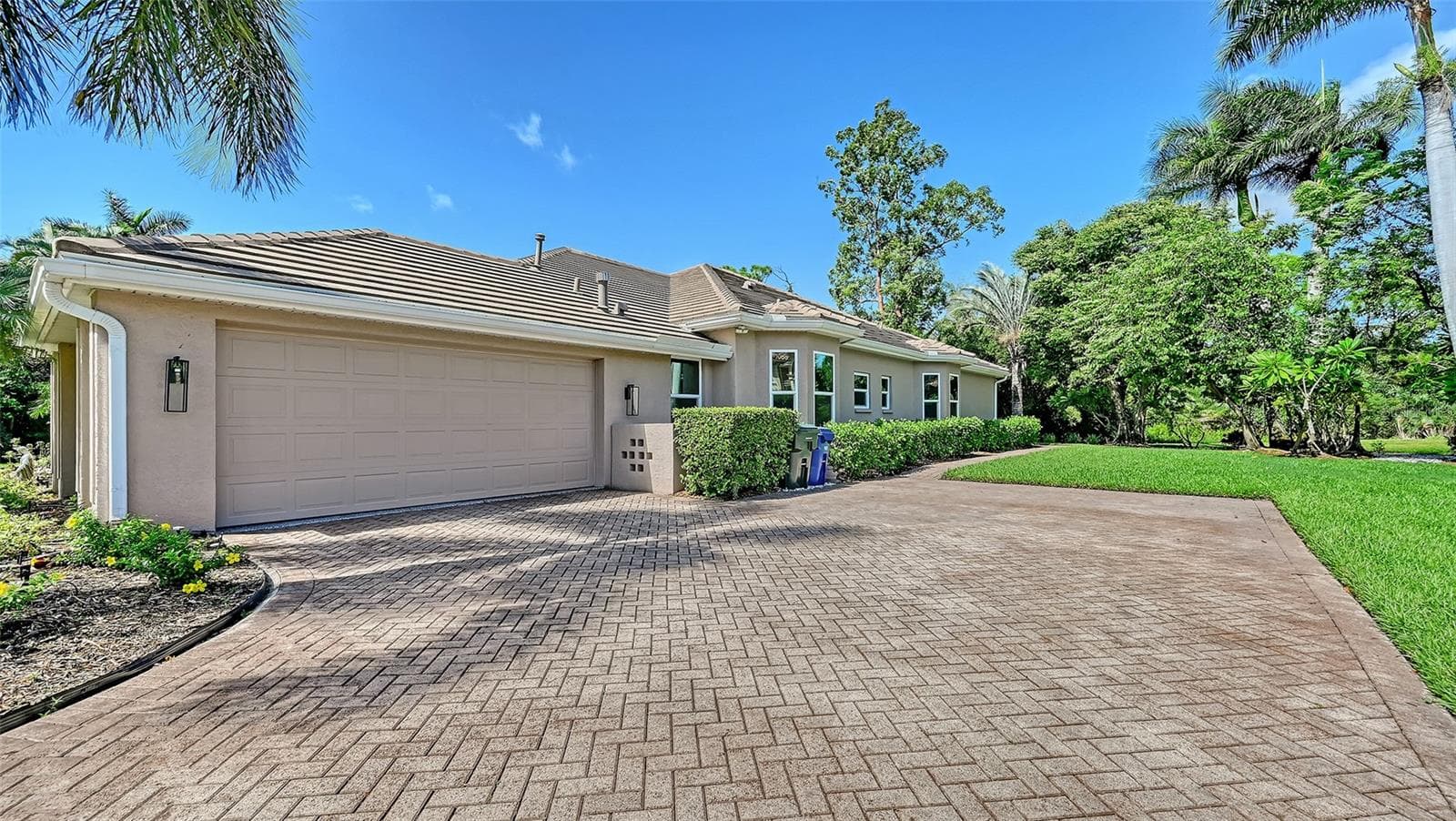 The two-car side entry garage. - 8866 BLOOMFIELD BLVD, SARASOTA