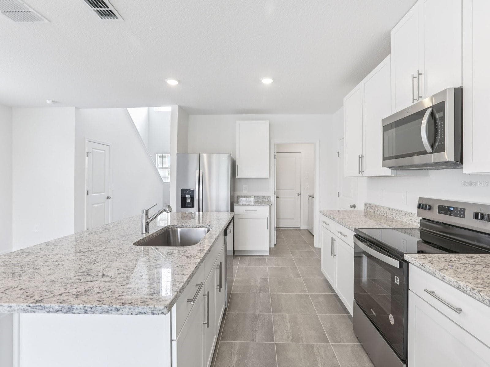 Photo is not of the actual home, but is an inspirational photo of builder’s model home and may depict options, furnishings, and/or decorator features that are not included - 11341 BELLEWOOD TER, PARRISH