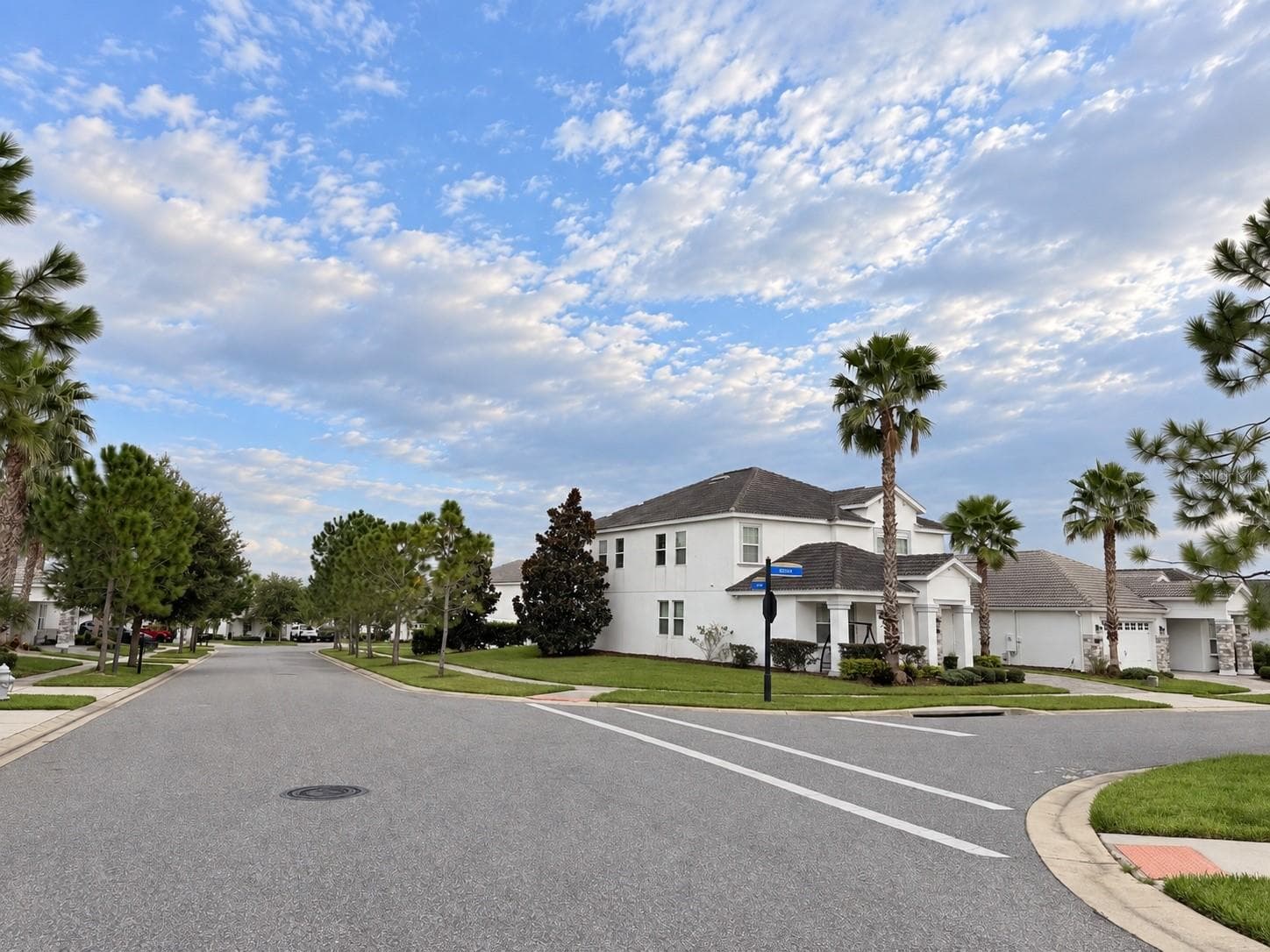Street view showcasing the home's desirable corner-lot. - 1516 BUNKER DR, DAVENPORT
