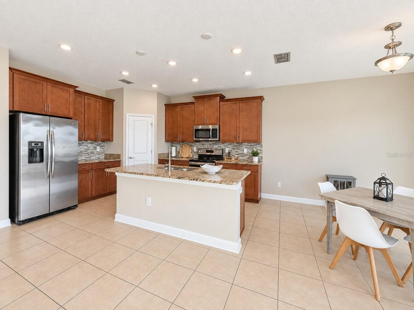 Open dining space connects naturally with the kitchen and main living areas. - 1516 BUNKER DR, DAVENPORT
