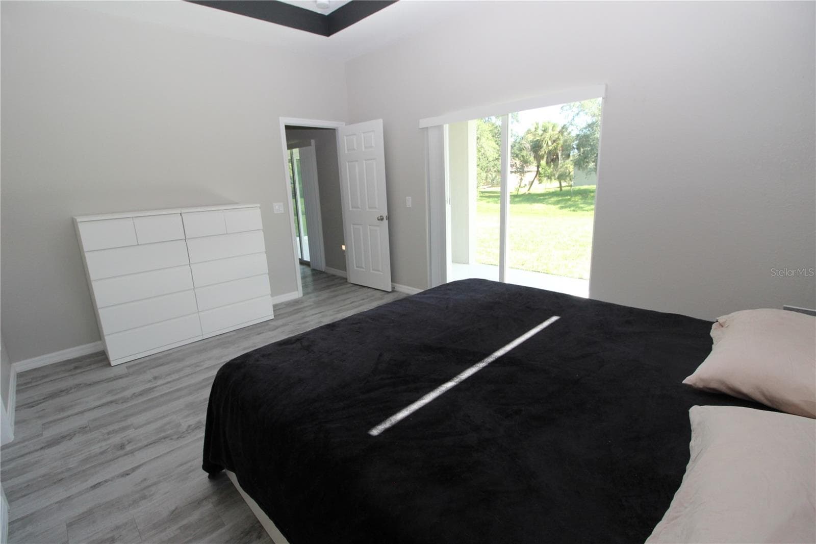 Primary Bedroom with sliding glass doors out to your private/covered lanai... - 1888 FRANKLIN LN, NORTH PORT