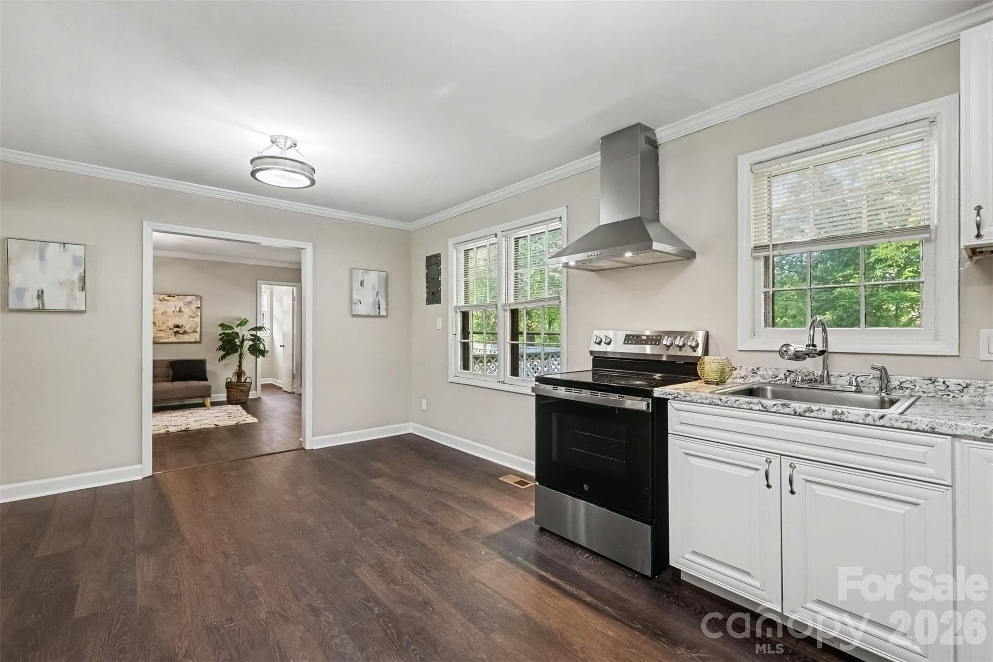 A window at the sink and green views while you cook. And the family room just steps from the eat-in dining area. - 502 Plantation Road, Lancaster