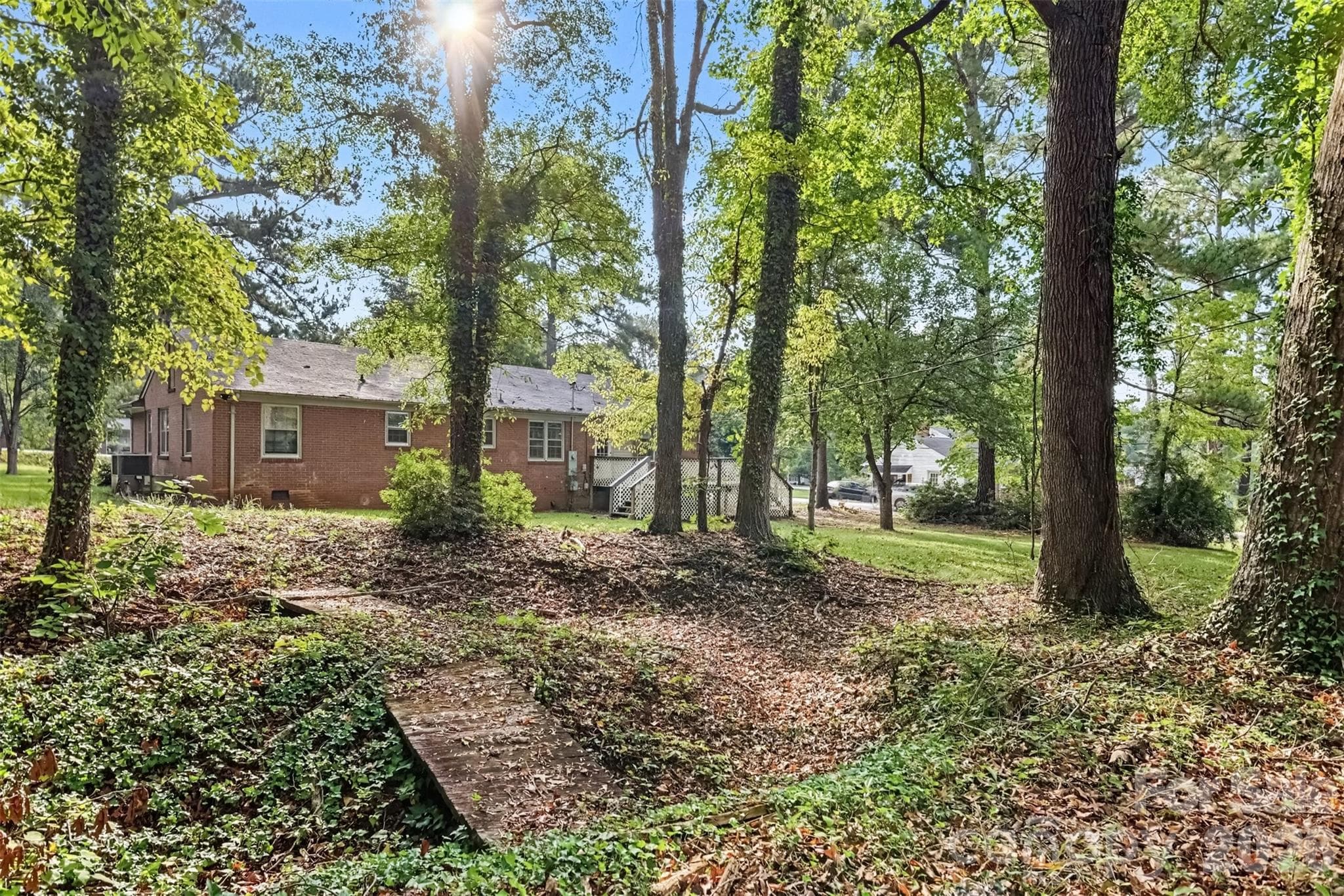 Mature trees, a footbridge, and a backyard with character - 502 Plantation Road, Lancaster