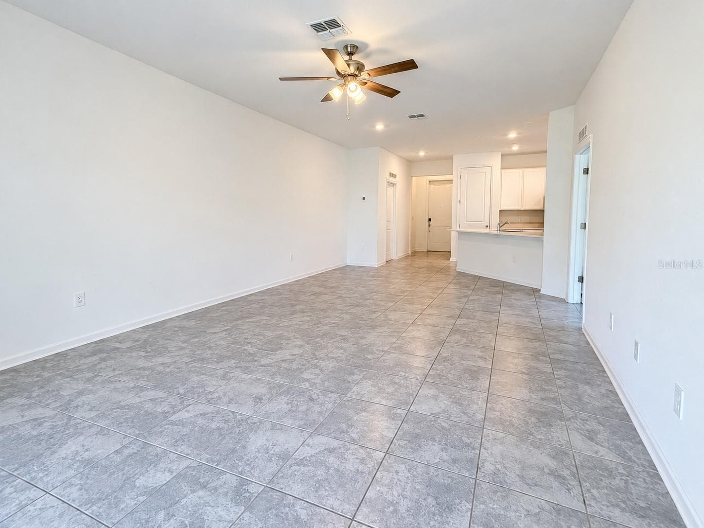 Living room from patio door - 546 HATTERAS RD, DAVENPORT