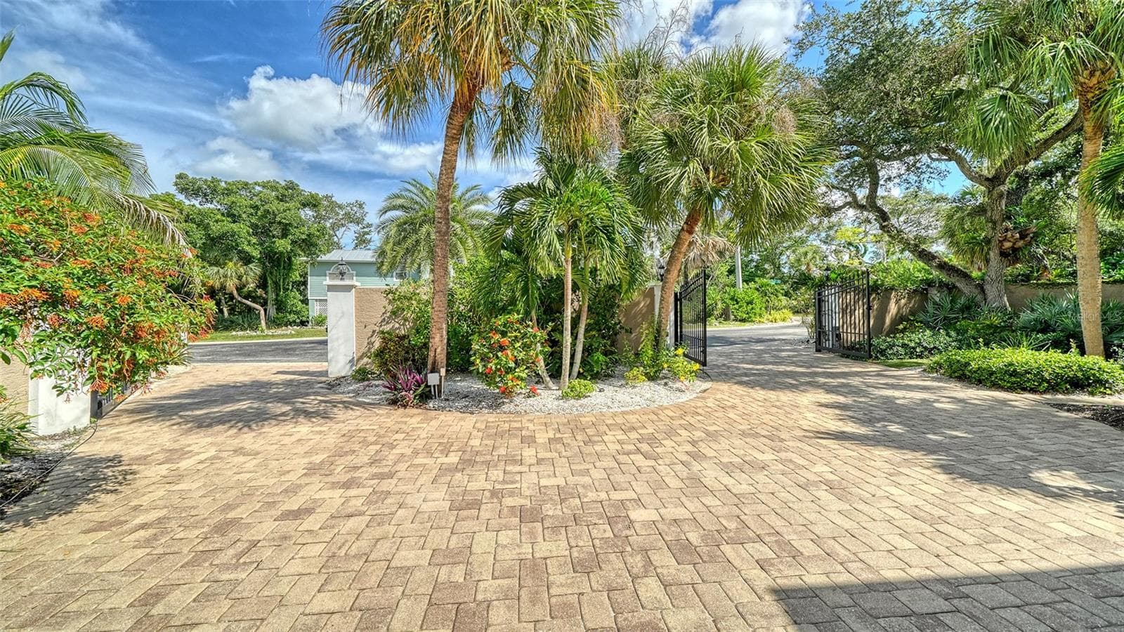 Expansive paver driveway, resurfaced in 2025, provides plenty of space for parking. - SARASOTA