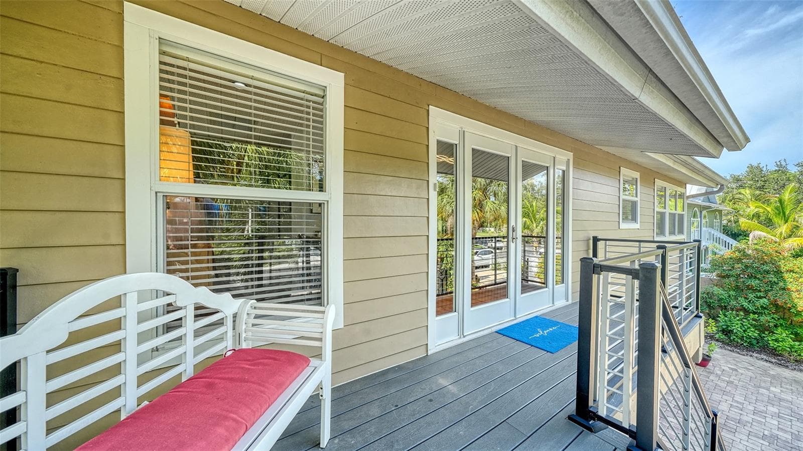 Welcoming covered front porch with composite decking. - SARASOTA