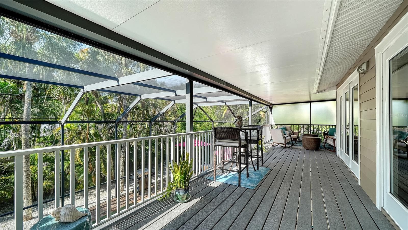 Expansive screened balcony provides additional outdoor living and entertaining space. - SARASOTA