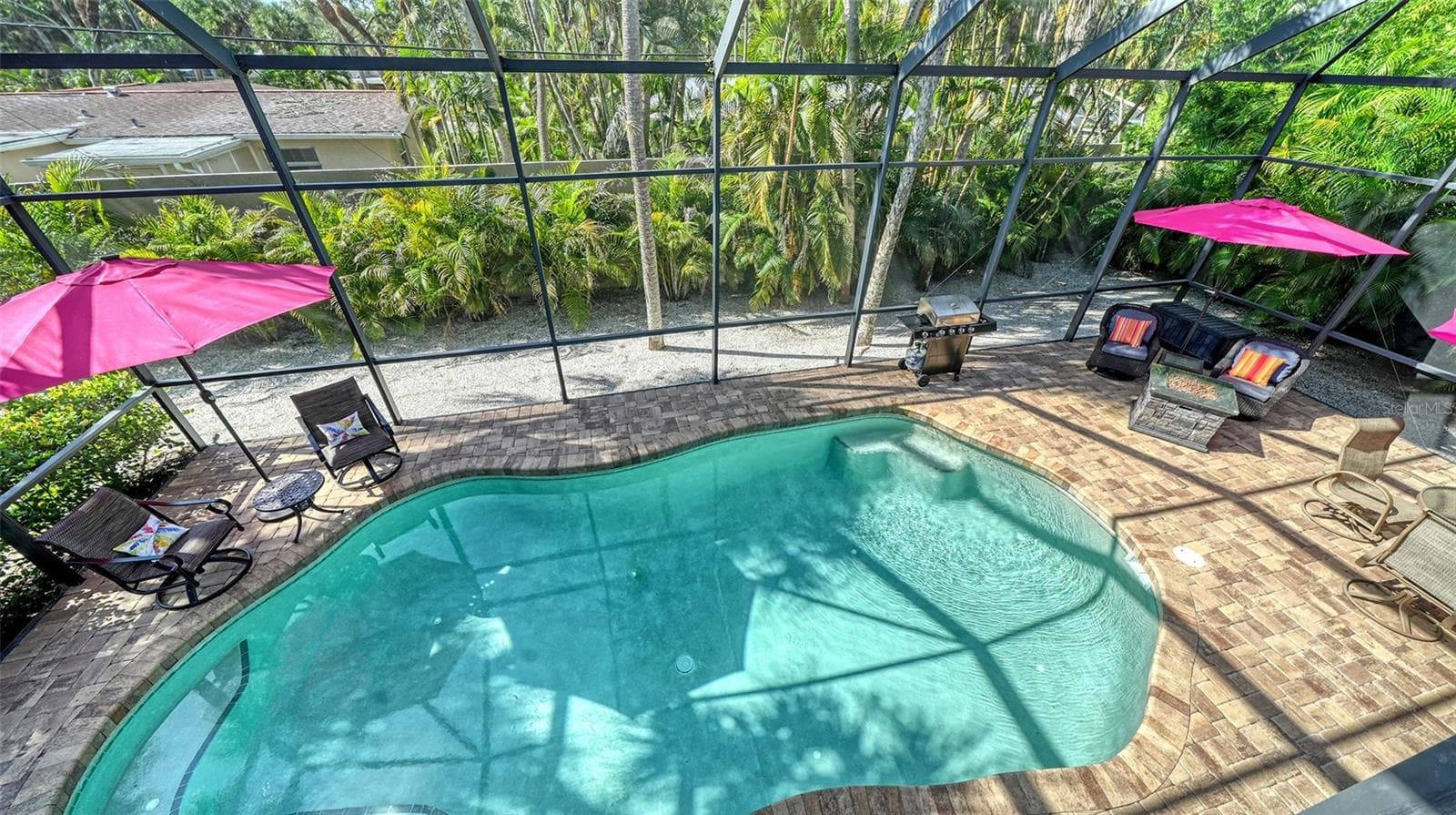 View of the heated saltwater pool from the elevated main living level. - SARASOTA