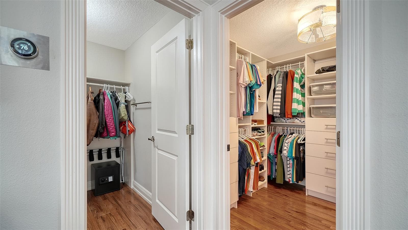 Thoughtfully redesigned walk-in closet with custom organization. - SARASOTA