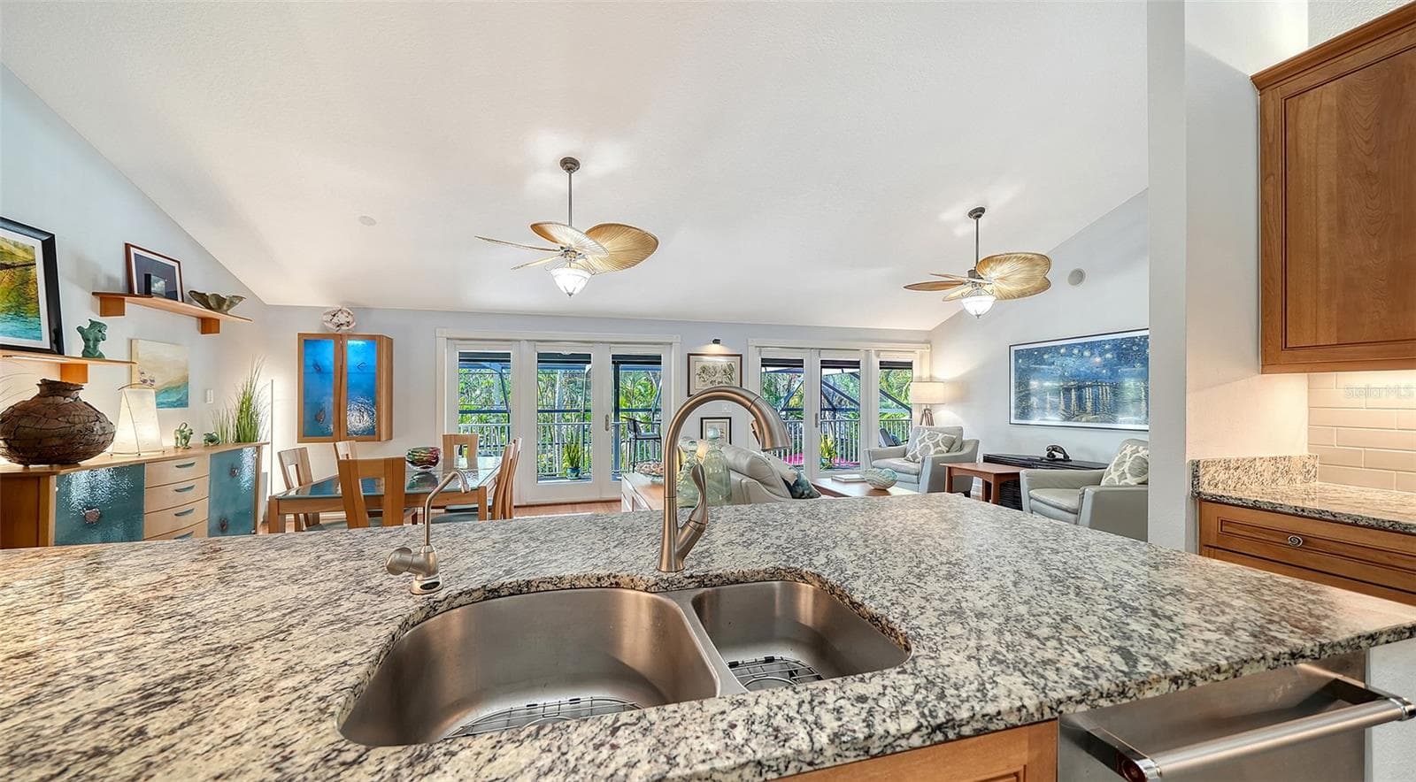 Generous granite breakfast bar provides additional seating and workspace. - SARASOTA