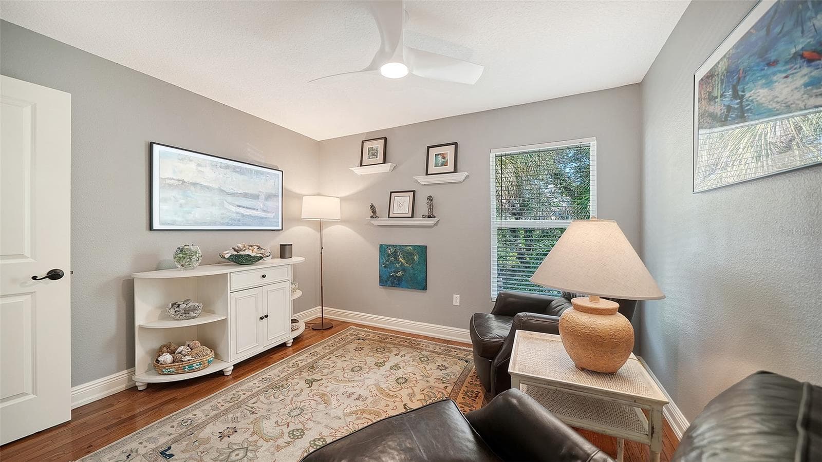 Bright guest bedroom or flexible space with hardwood flooring. - SARASOTA