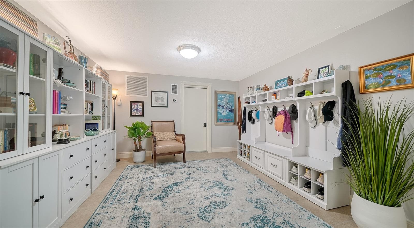 Another view highlighting the extensive built-in cabinetry and storage. - SARASOTA