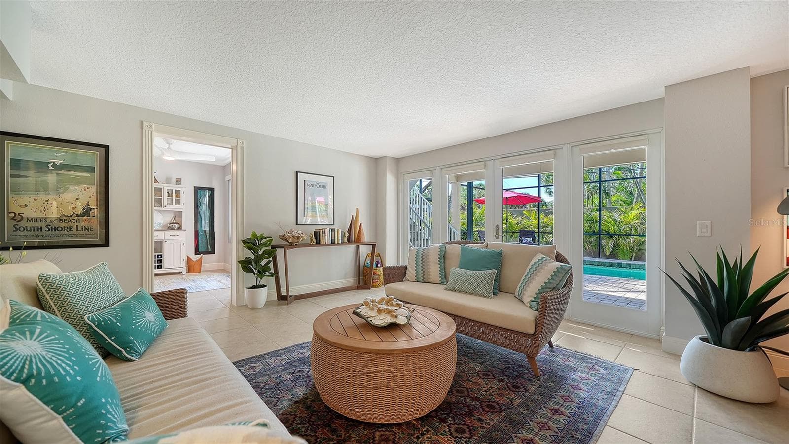 Spacious family room with French doors leading directly outside. - SARASOTA