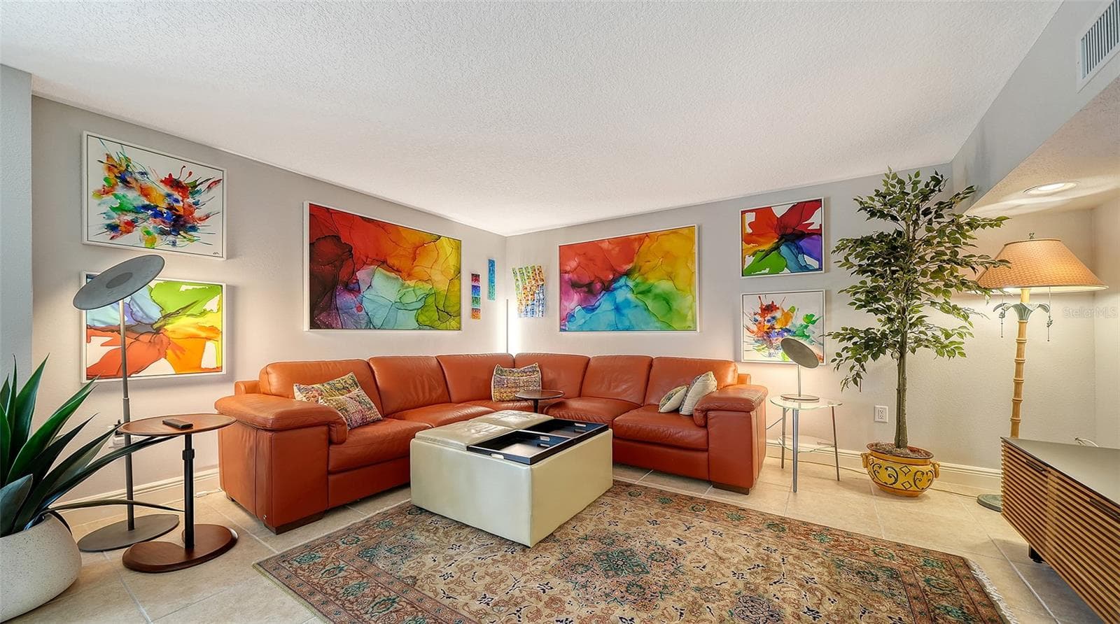 Generously sized lower-level family room provides multiple options for relaxing and entertaining. - SARASOTA