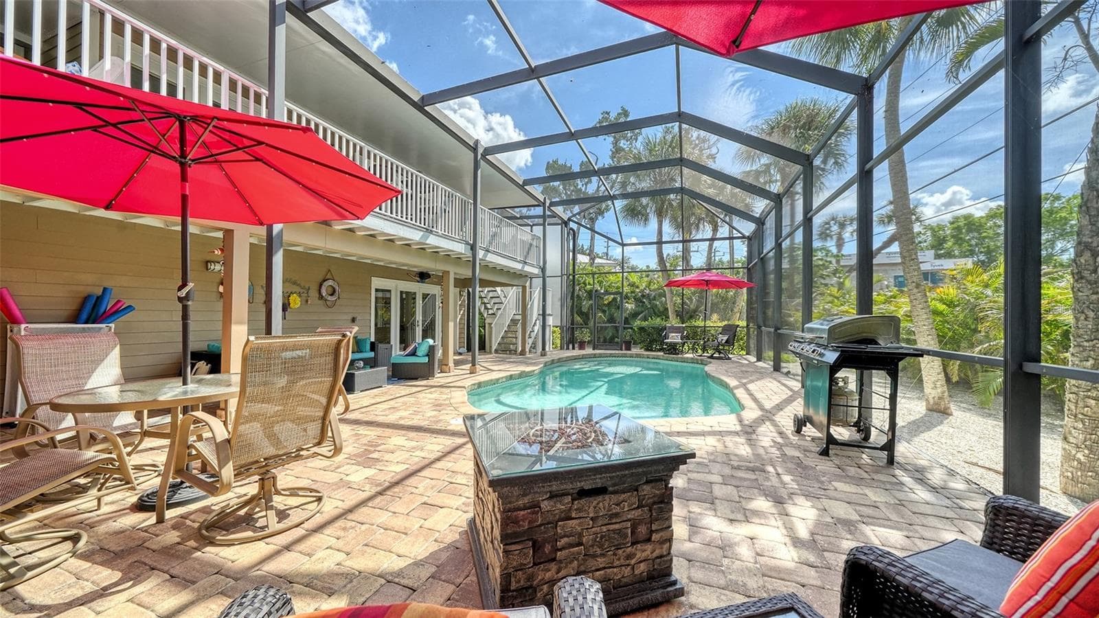 Expansive screened pool area with plenty of room for lounging and entertaining. - SARASOTA