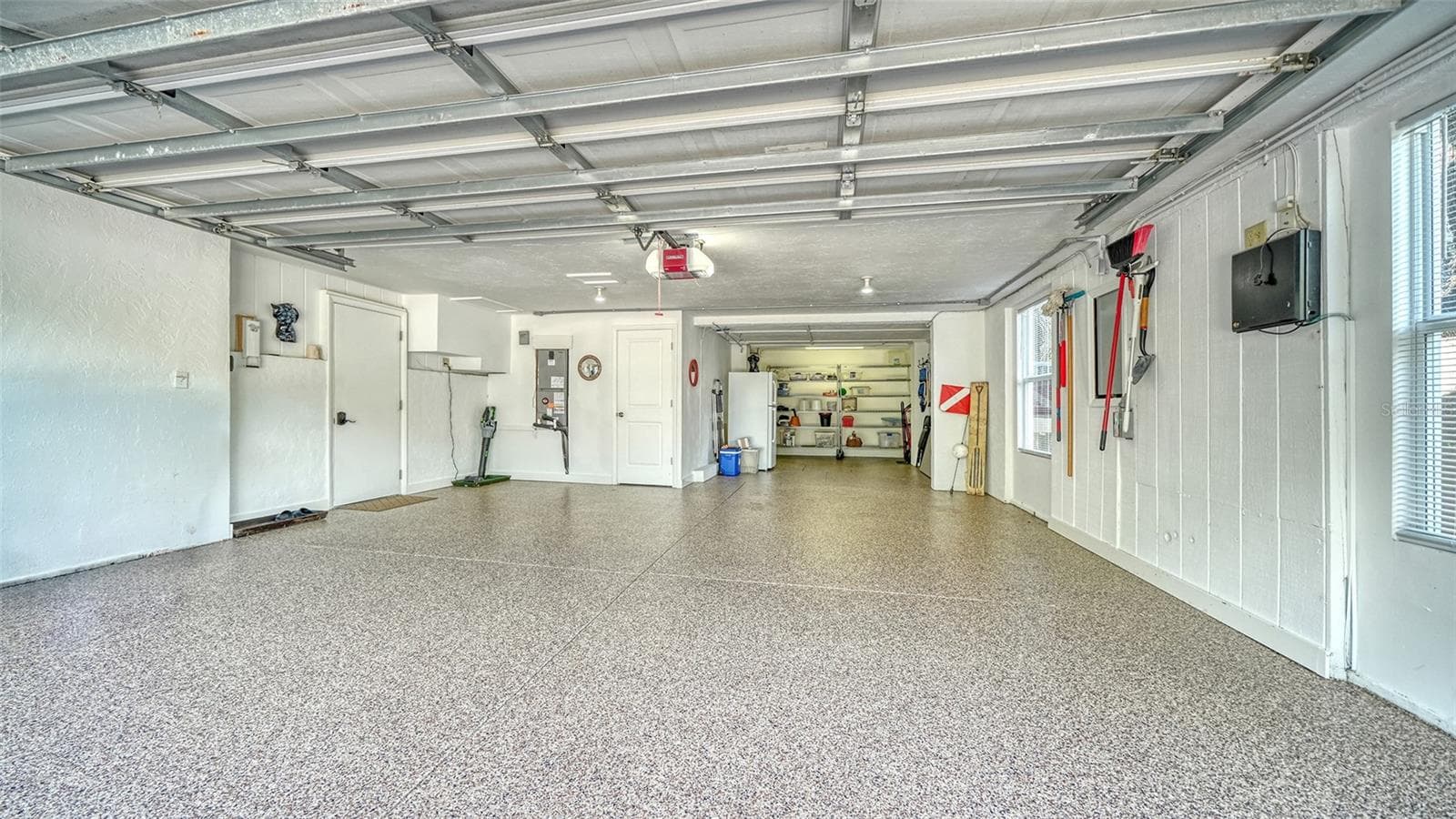 Oversized two-car garage with resurfaced and sealed floor and additional storage. - SARASOTA