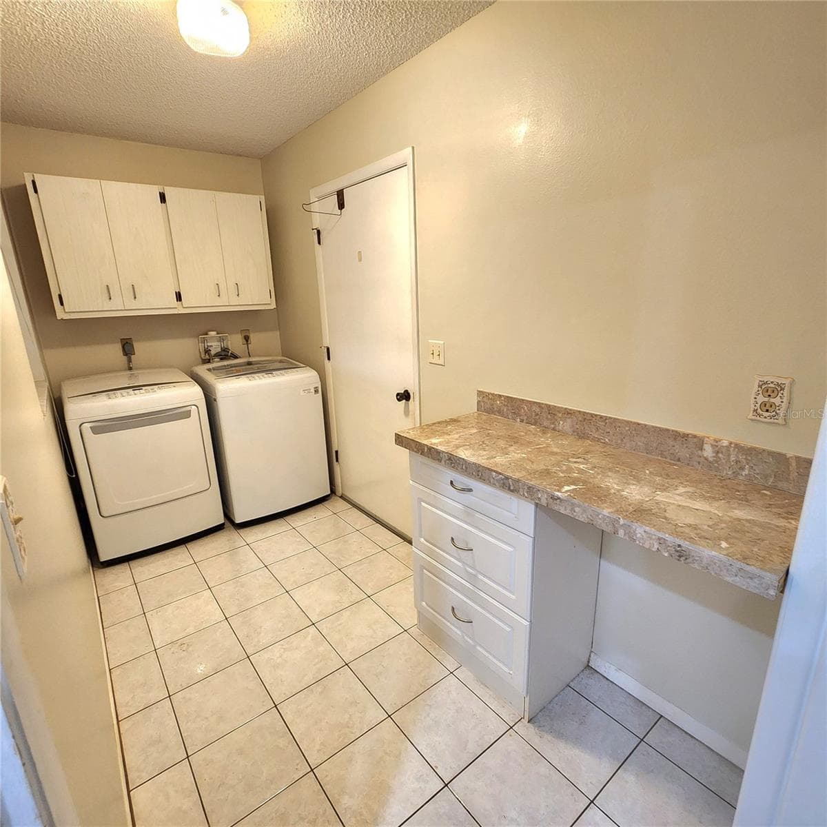 Laundry room with cabinets and desk - 49 SANDSTONE CIR, VENICE
